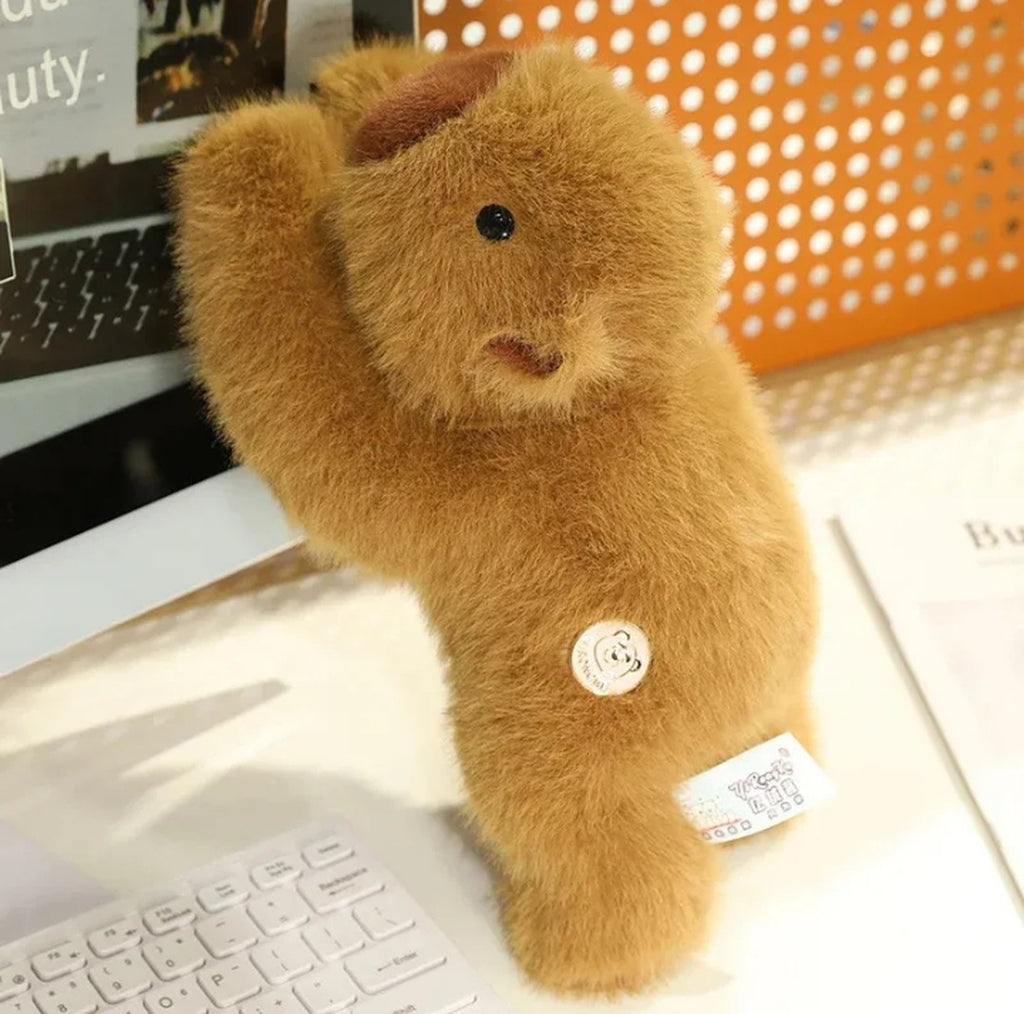 Weighted capybara plush standing upright with one arm raised
